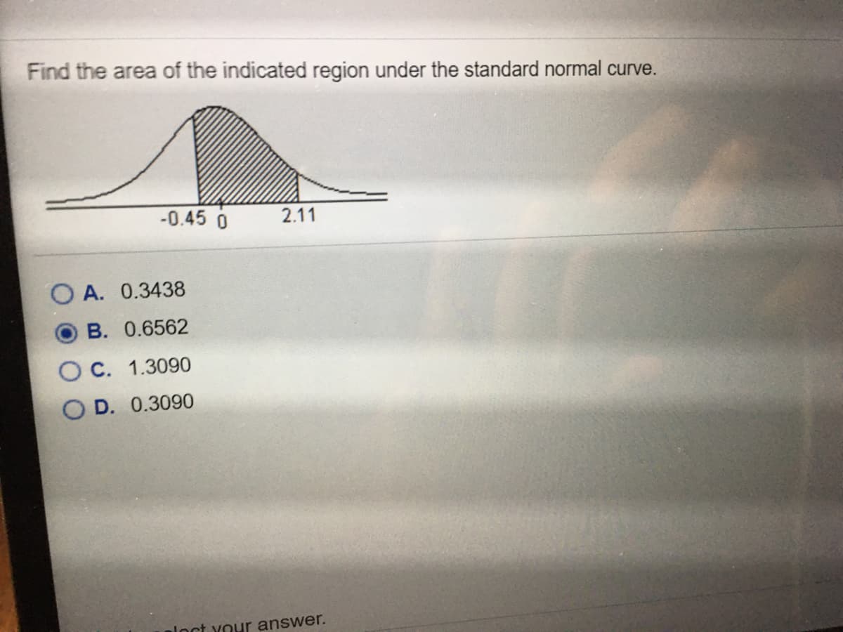 Find the area of the indicated region under the standard normal curve.
-0.45 0
2.11
A. 0.3438
В. 0.6562
С. 1.3090
O D. 0.3090
aloct your answer.
