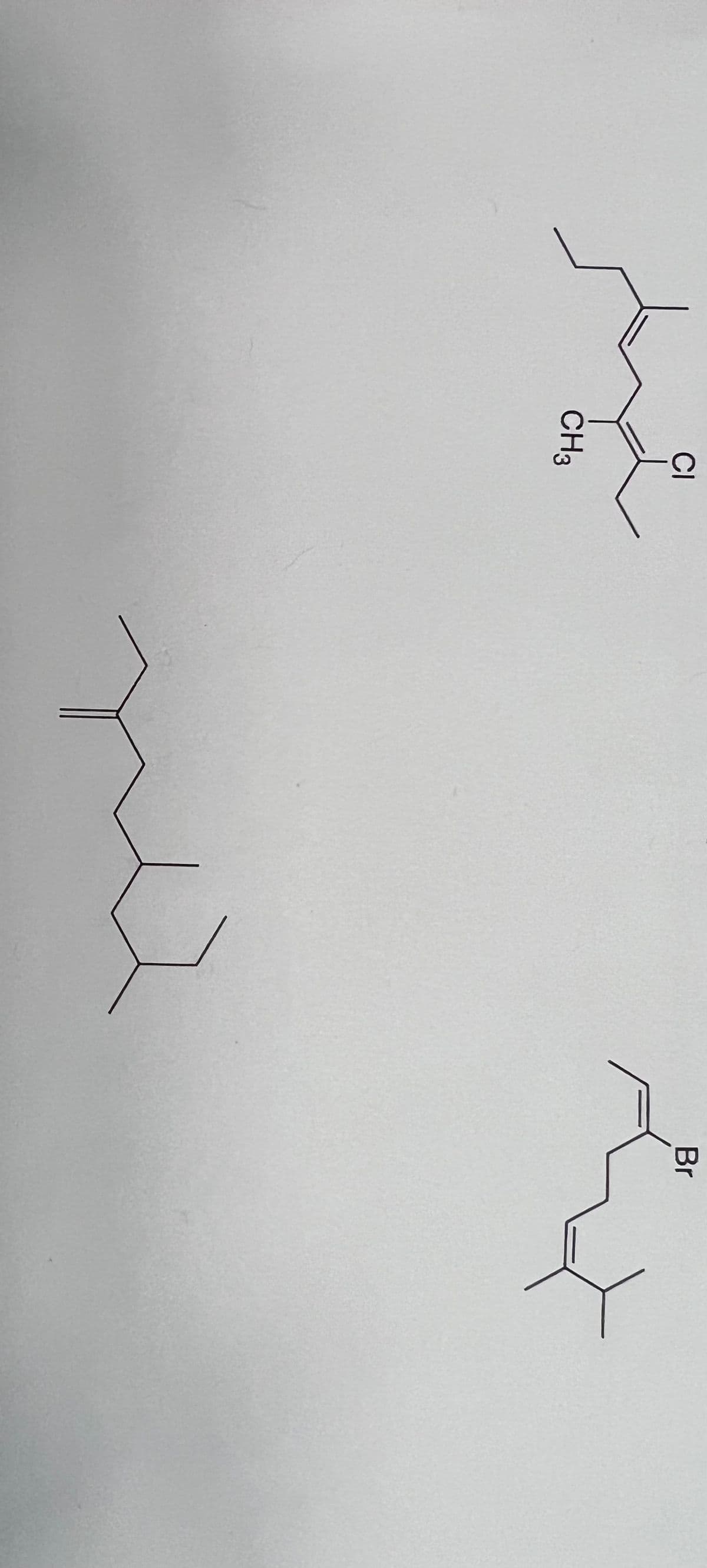 **Alkene Reactions and Halogenation**

In organic chemistry, alkenes are hydrocarbons that contain carbon-carbon double bonds (C=C). They undergo various chemical reactions, one of which includes halogenation where halogens (chlorine, bromine, etc.) add to the double bond. Presented below are structural representations and transformations related to this concept.

### Chemical Structures

The image contains three chemical structures, demonstrating a typical alkene and its halogenated derivatives.

1. **Structure 1 (Top Right - Halogenated Alkene with Chlorine)**
   - **Description**: This structure denotes an organic molecule where chlorine (Cl) is attached to one carbon of a carbon-carbon double bond.
   - **Formula**: On one end, there is a CH₃ group (methyl), and adjacent to it, a chlorine atom (Cl) attached to a carbon involved in a double bond. 
   - **Detailed Structure**: There are two carbon groups attached to the double bond, each having substituents, one of which is chlorine.

2. **Structure 2 (Middle - Basic Alkene)**
   - **Description**: This is an alkene with a simple carbon-carbon double bond without any substituents other than hydrogen and alkyl groups.
   - **Formula**: The structure includes an unbranched chain with a double bond between two central carbons, flanked by alkyl groups ensuring the carbon atoms are fully saturated.

3. **Structure 3 (Bottom Right - Halogenated Alkene with Bromine)**
   - **Description**: Similar to the chlorine example, but in this structure, a bromine (Br) atom replaces chlorine. 
   - **Formula**: The rest of the structure is similar to the first, showing that replacing chlorine with bromine follows the same alkenation process.
   - **Detailed Structure**: There are alkyl groups alongside the double bond, with bromine attached to a carbon engaged in the double bond.

### Explanation

These structures demonstrate:
- An alkene can add halogens to its carbon-carbon double bond.
- Different halogens (Cl, Br) can replace Hydrogen in halogenation reactions, while the carbon framework remains similar.
- The structural differences are critical in applications ranging from polymer science to pharmaceuticals.

Understanding these basics is crucial for further exploration of organic reaction mechanisms and synthetic pathways in chemistry.

**Note**: For precise chemical names