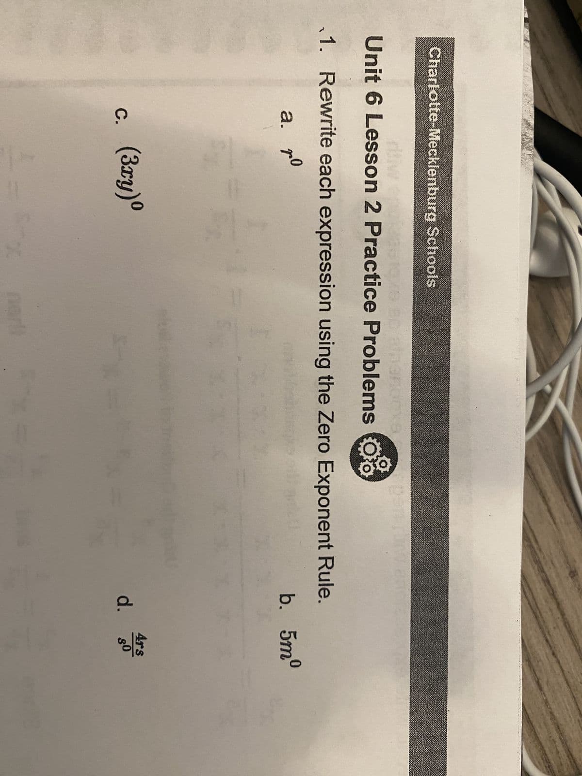 Charlotte-Mecklenburg Schools
35 10x680 Bipanocka
Unit 6 Lesson 2 Practice Problems o
1. Rewrite each expression using the Zero Exponent Rule.
a. 70
ро
c. (3xy)⁰
B
b. 5mº
d.
4rs
$0