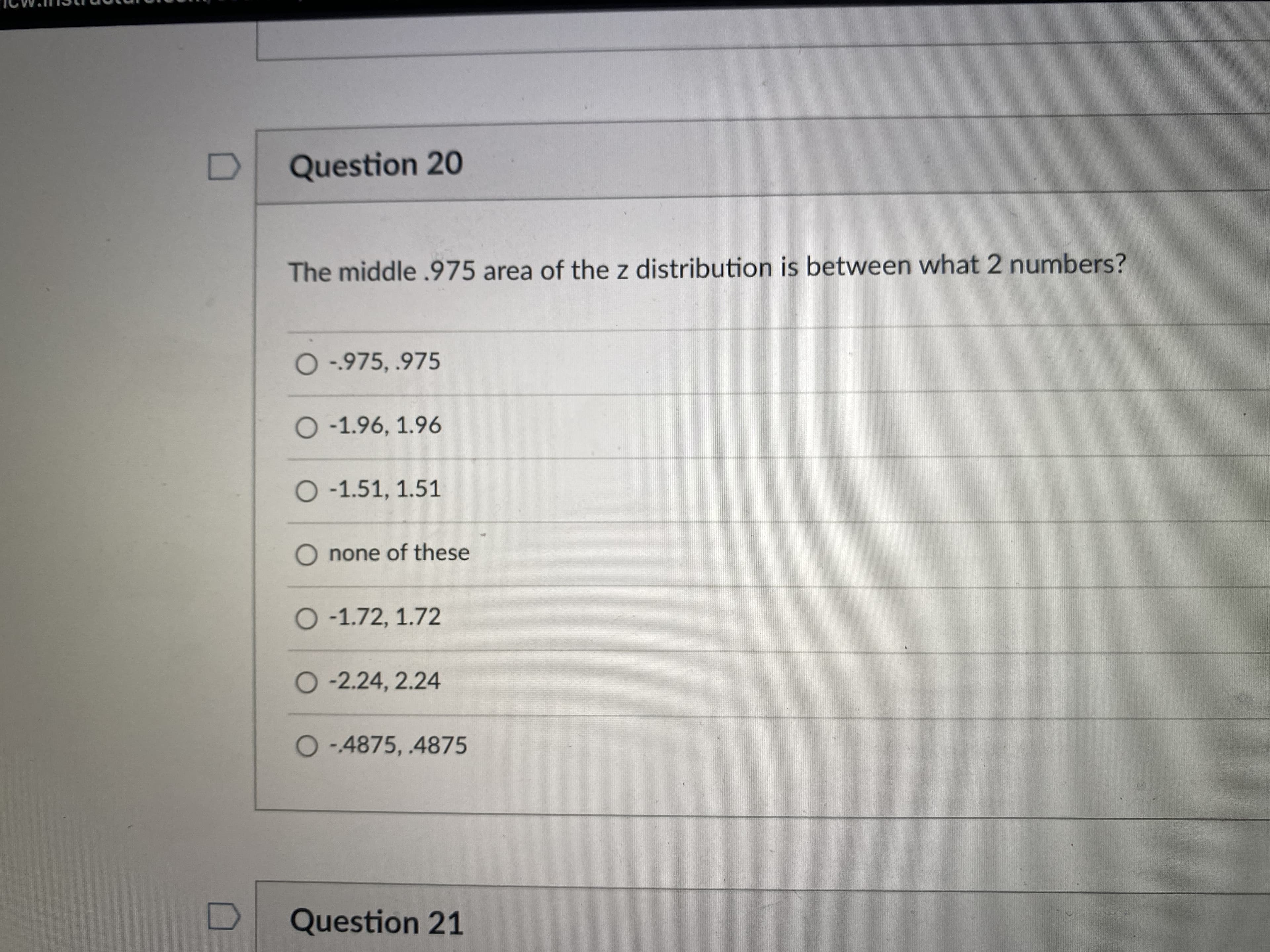 The middle .975 area of the z distribution is between what 2 numbers?
