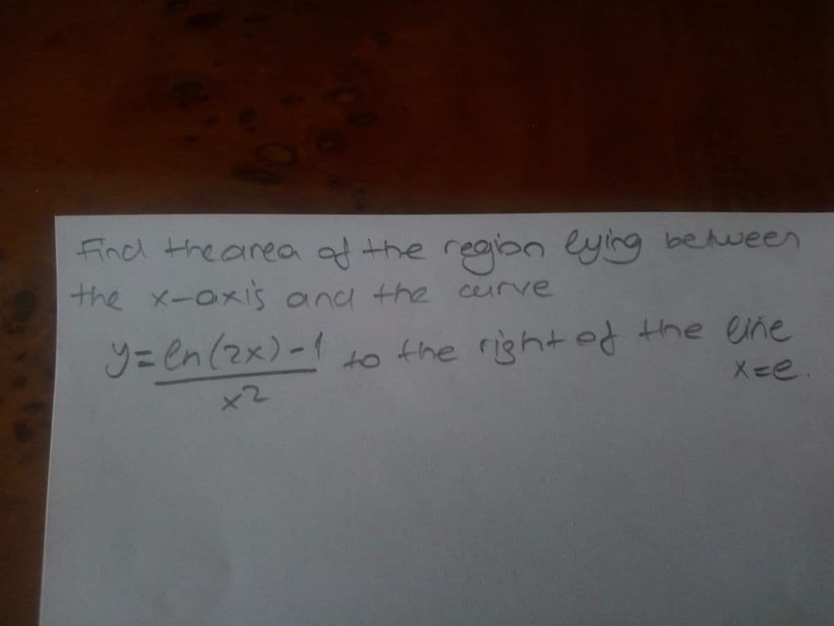 Find the area ad the reabn eying behween
the x-axi's and the curve
y=en(2x)-1
to the right d the ene
X-e.
