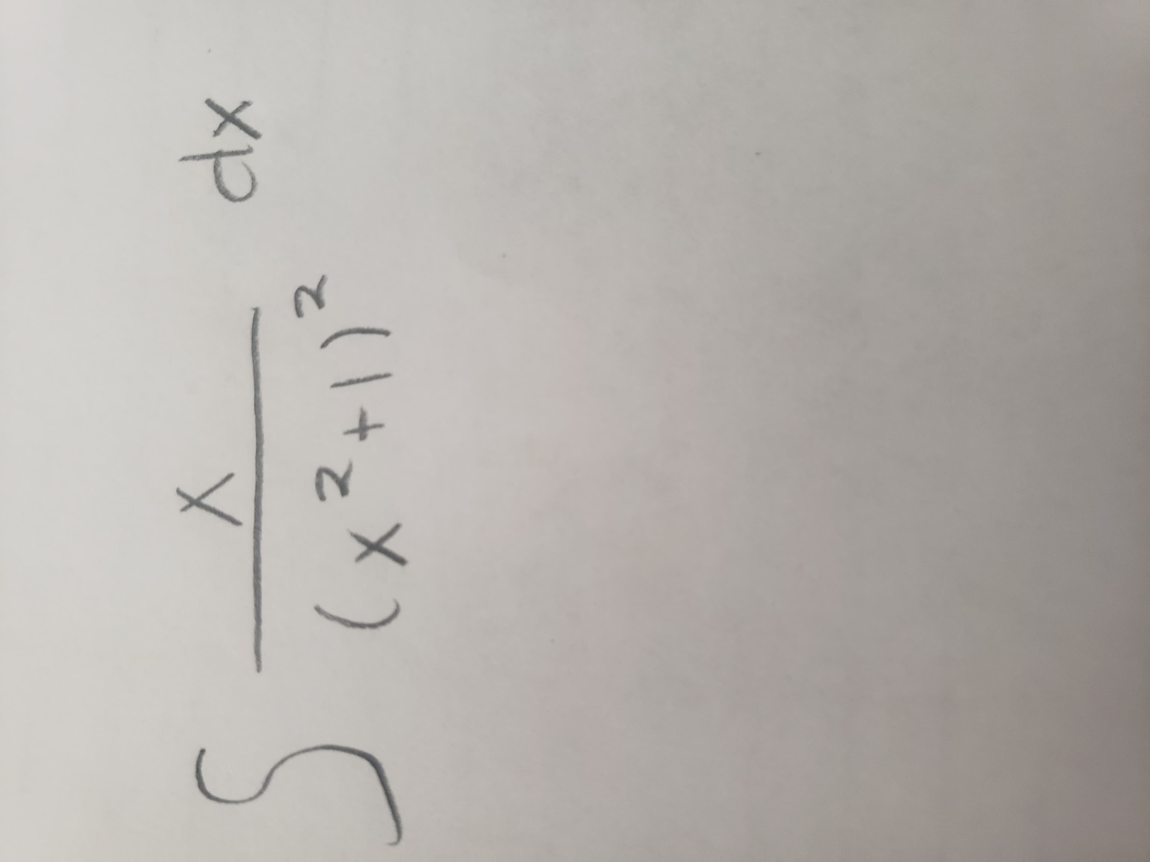 The image displays a mathematical integral. The integral can be described as:

\[ \int \frac{x \, dx}{(x^2 + 1)^2} \]

This integral represents a function that can be solved using methods of integration, specifically focusing on rational functions and polynomial functions. 

In simpler terms, it's an expression involving an integral (symbolized by the elongated 'S'), a fraction where the numerator is \(x \) and the denominator is \((x^2 + 1)^2 \), and the variable of integration, \(dx\), indicating that we are integrating with respect to \(x\).