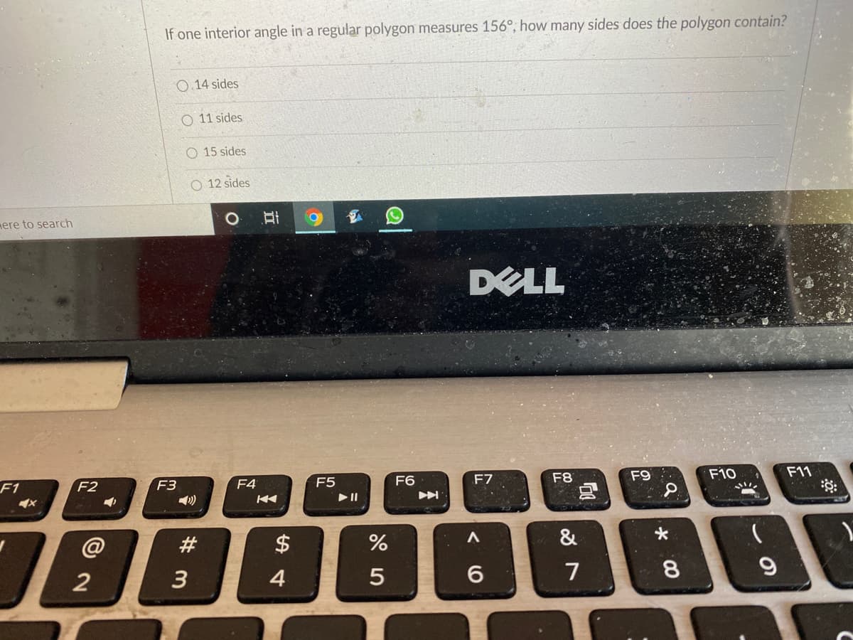 If one interior angle in a regular polygon measures 156°, how many sides does the polygon contain?
14 sides
O 11 sides
O 15 sides
O 12 sides
mere to search
DELL
F7
F8
F9
F10
F11
F1
F2
F4
F5
F6
F3
18888
@
#
$
&
2
3
4
7
8
大
