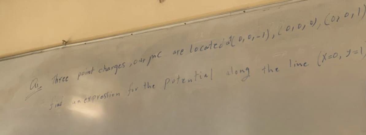 A Three point charges, our pc are located a(0, 0, -1), (0, 0, 0), (0,0,1)
un expression for the potential along the line (X=0, y=1