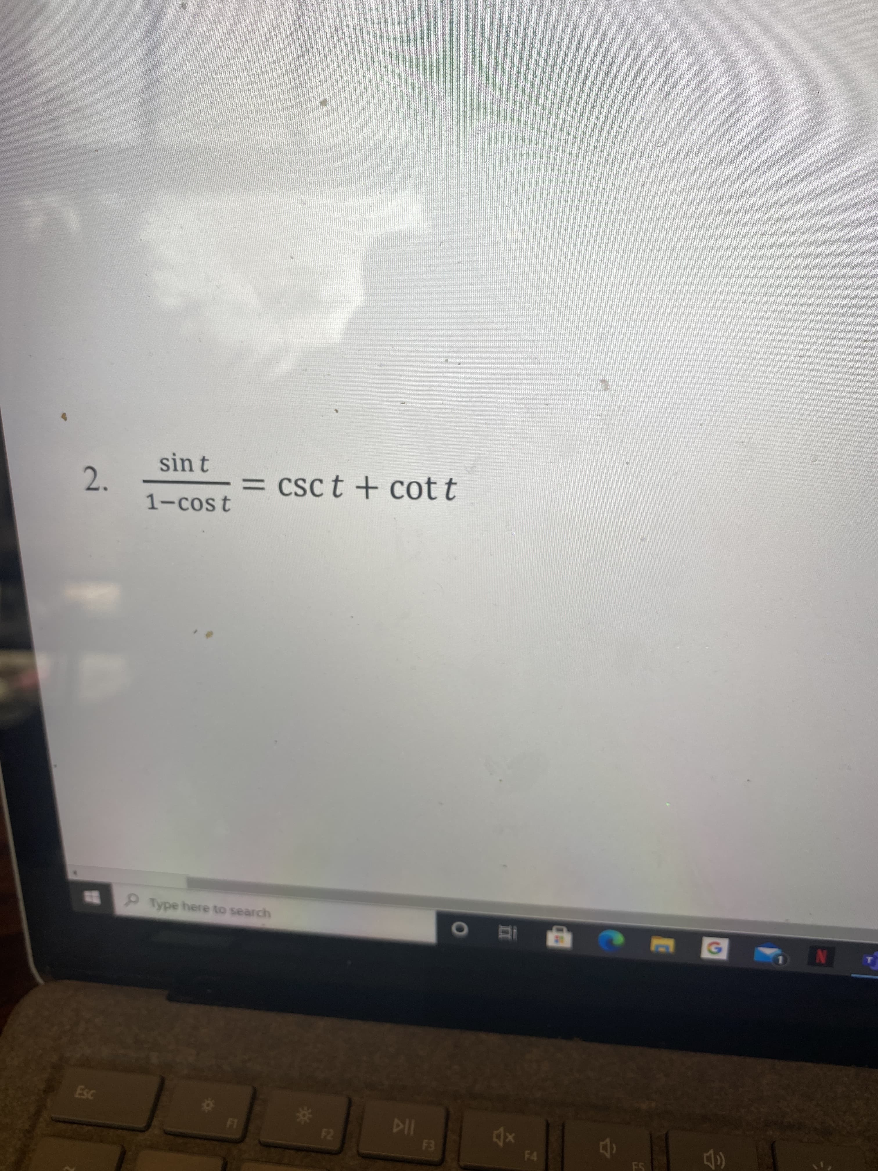 The image contains a trigonometric identity problem labeled as question 2. The equation is:

\[ \frac{\sin t}{1 - \cos t} = \csc t + \cot t \]

This equation involves trigonometric functions: sine (\(\sin\)), cosine (\(\cos\)), cosecant (\(\csc\)), and cotangent (\(\cot\)). The goal is typically to prove or verify that the left side of the equation is equivalent to the right side using known trigonometric identities. 

### Explanation:
- **Left Side**: The expression \(\frac{\sin t}{1 - \cos t}\) requires manipulation or identities to simplify.
- **Right Side**: The expression \(\csc t + \cot t\) can be rewritten in terms of sine and cosine:

  \[
  \csc t = \frac{1}{\sin t}, \quad \cot t = \frac{\cos t}{\sin t}
  \]

  Therefore:
  
  \[
  \csc t + \cot t = \frac{1}{\sin t} + \frac{\cos t}{\sin t} = \frac{1 + \cos t}{\sin t}
  \]

Students should use trigonometric identities to manipulate both sides until they match, such as Pythagorean identities or algebraic manipulation.