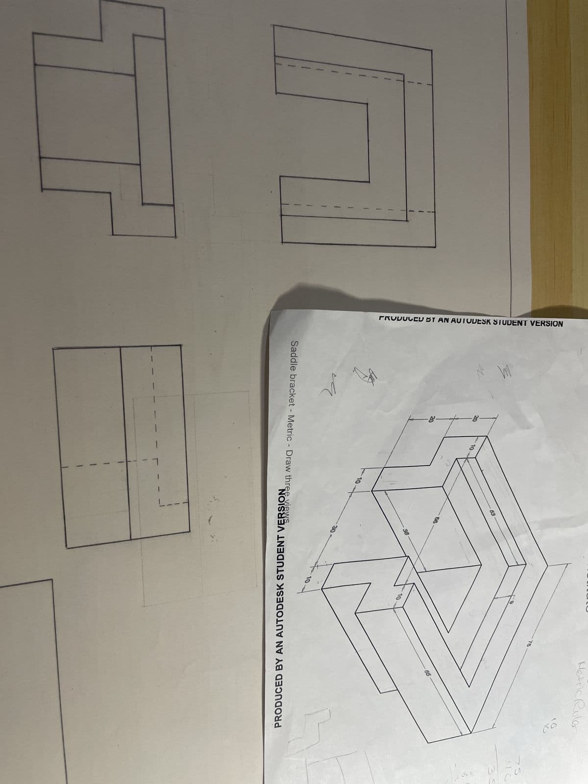 PRODUCED BY AN AUTODESK STUDENT VERSION
th
u
8
-8-
Saddle bracket - Metric - Draw three views
1
10-
1
-38
75
X
Metric Roler
66
10
10
PRODUCED BY AN AUTODESK STUDENT VERSION
75
чо
35
31