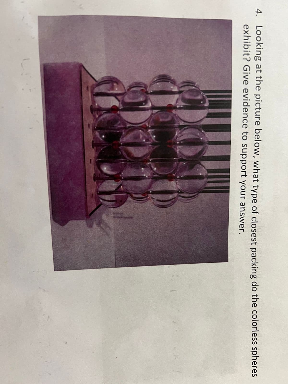 4. Looking at the picture below, what type of closest packing do the colorless spheres
exhibit? Give evidence to support your answer.