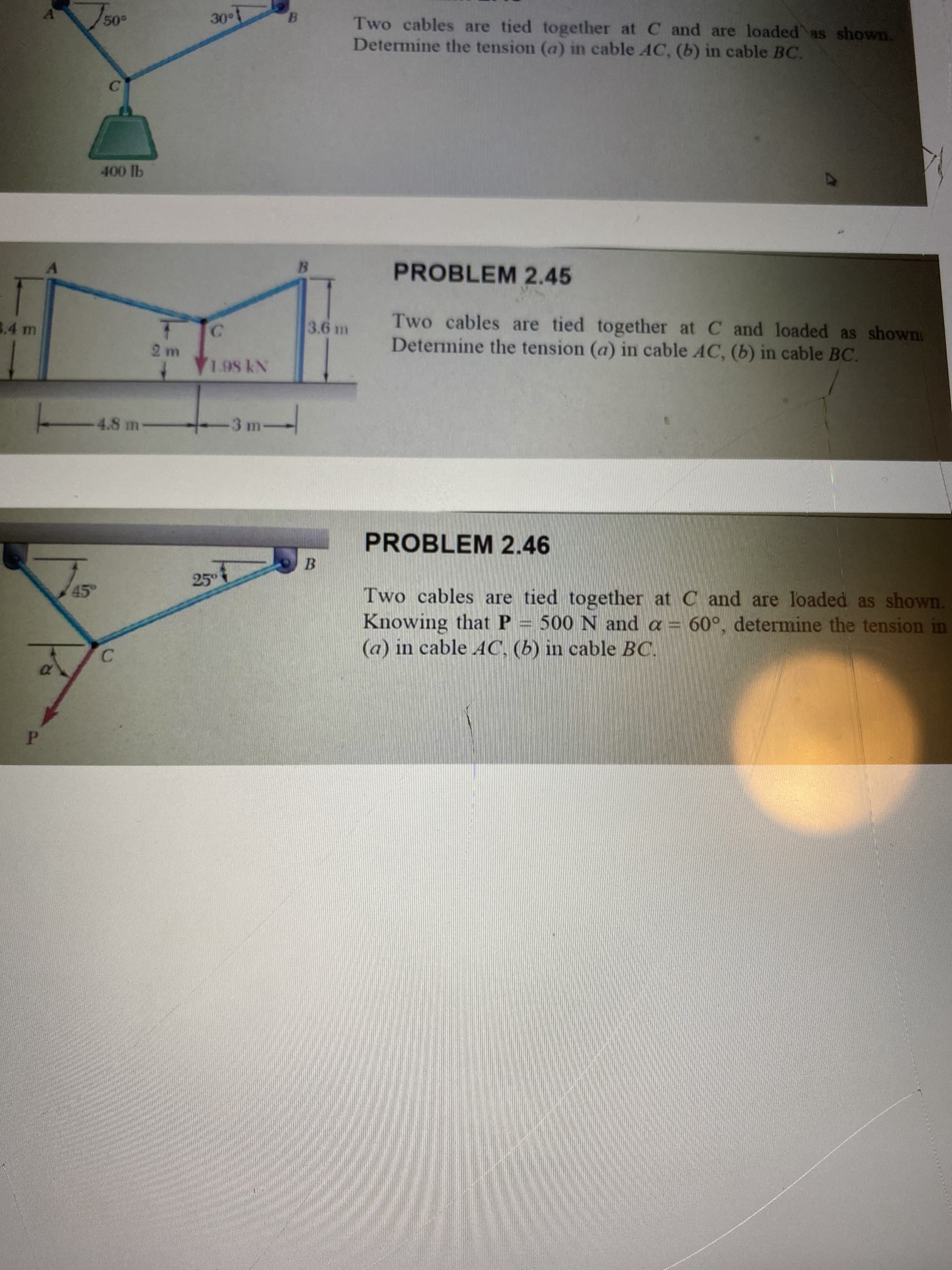 Two cables are tied together at C and are loaded as shown.
Determine the tension (a) in cable AC, (b) in cable BC.
