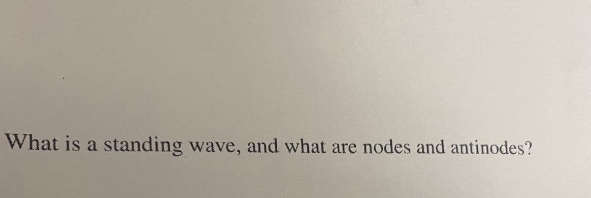 What is a standing wave, and what are nodes and antinodes?
