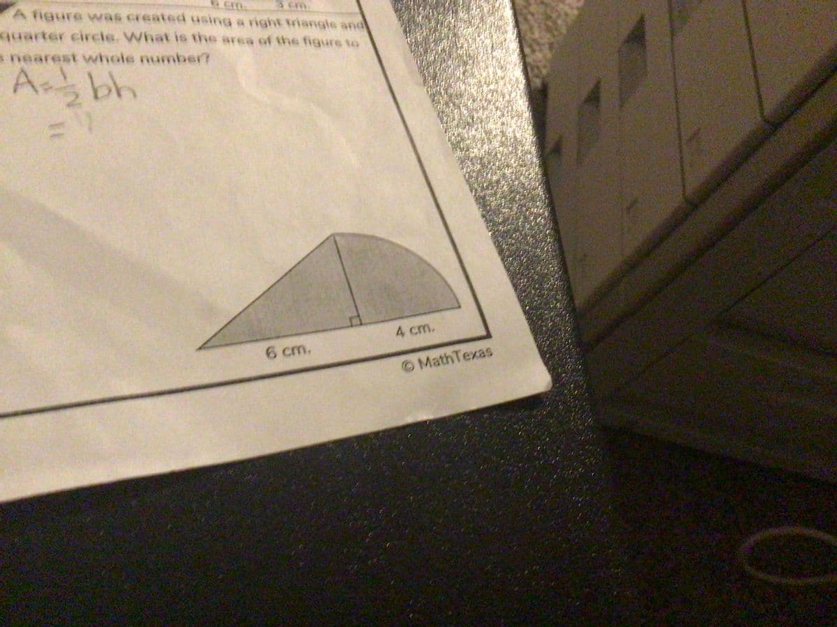 3 cm.
A figure was created using a right triangle and
quarter circle. What is the area of the figure to
s nearest whole number?
Abh
11
6 cm.
4 cm.
© MathTexas