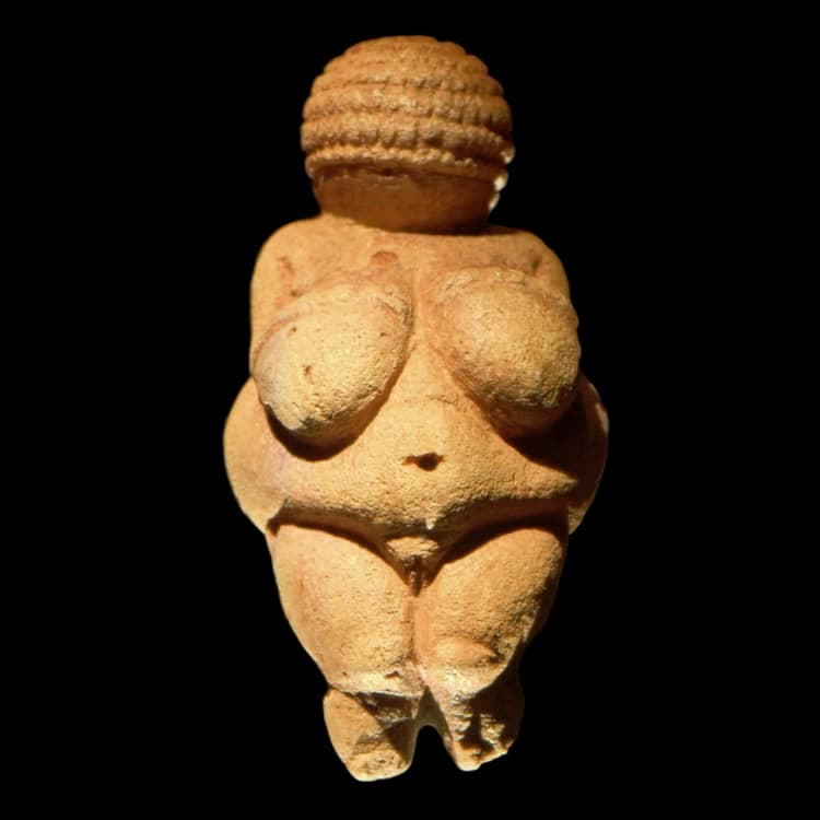 ## Venus of Willendorf

The Venus of Willendorf is one of the most famous and earliest known pieces of prehistoric art. This small statuette, typically dated to around 28,000–25,000 BCE, was discovered in 1908 near Willendorf, Austria. The figurine is carved from limestone and measures approximately 11 centimeters (4.3 inches) in height.

### Description and Significance

The Venus of Willendorf is notable for its exaggerated female features, including large breasts, rounded abdomen, and detailed genitalia. This emphasis on feminine attributes has led scholars to suggest that the figurine may have served as a fertility symbol or a depiction of an Earth Mother goddess.

Specific characteristics of the Venus of Willendorf include:
- **Hair/Head**: The head is covered with what appears to be carefully sculpted and detailed hair or perhaps a woven hat, featuring elaborate circular patterns.
- **Body**: The body is corpulent, with particularly prominent breasts, a pronounced stomach, and wide hips, representing various stages of womanhood or idealized fertility traits.
- **Arms & Legs**: The arms are comparatively small and rest on the breasts; the legs are short and tapered, with the feet not clearly defined.
- **Materials**: The figurine is carved from oolitic limestone and was originally tinted with red ochre.

### Cultural Context

The statuette's exaggerated features were likely intended to convey fertility, health, and abundance, thus playing a role in rituals or societal beliefs about childbirth and femininity. The period during which it was created, the Upper Paleolithic, saw the emergence of such symbols, with similar figurines being found across Europe.

### Conclusion

The Venus of Willendorf remains an important artifact in the study of prehistoric art and human cultural evolution. It serves as a window into the symbolic and artistic practices of early human societies and continues to influence discussions about gender, art, and anthropology.

### Key Points
- **Age**: Approximately 28,000–25,000 BCE
- **Material**: Limestone with traces of red ochre
- **Dimensions**: Roughly 11 cm in height
- **Discovered in**: Willendorf, Austria, 1908
- **Function**: Likely a fertility symbol or a depiction of an Earth Mother goddess

By examining artifacts like the Venus of Willendorf, we gain insight into the values, beliefs, and artistic expressions of our early ancestors.