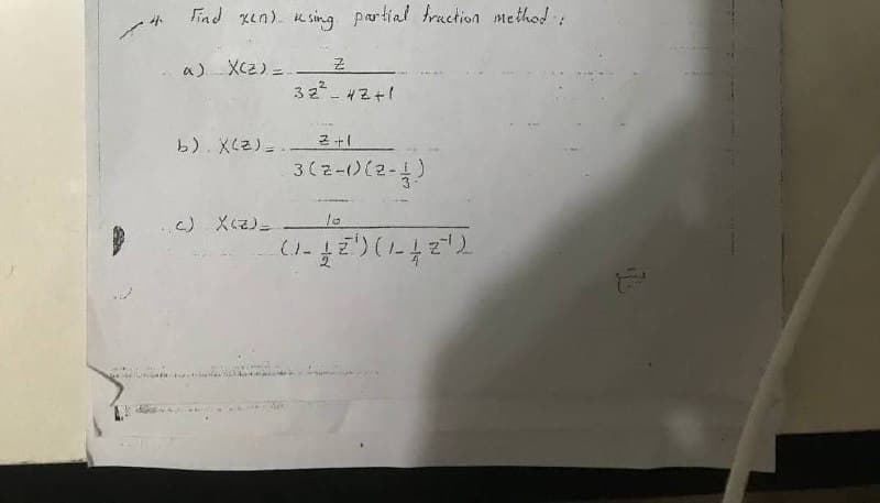 Find xen). Ksing partial fruction method
a) Xcz) =-
32 - 4Z+1
b). X(2) =
2十1
3(z-)(2-4)
10
